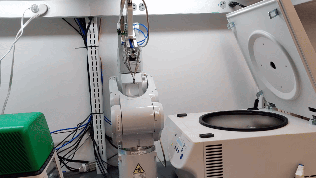 Robot loading a centrifuge